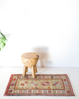 Vintage Turkish mini rug in room decor setting, old rug, antique rug, pastel colors, faded colors, Turkish rug, vintage rug, soft rug, Portland, Oregon, rug store, rug shop, local shop