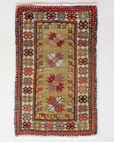 Vintage Turkish mini rug in room decor setting, old rug, antique rug, pastel colors, faded colors, Turkish rug, vintage rug, soft rug, Portland, Oregon, rug store, rug shop, local shop