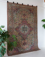 Vintage Turkish rug in living room setting, old rug, antique rug, pastel colors, faded colors, Turkish rug, vintage rug, soft rug, Portland, Oregon, rug store, rug shop, local shop