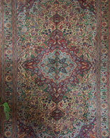 Vintage Turkish rug in living room setting, old rug, antique rug, pastel colors, faded colors, Turkish rug, vintage rug, soft rug, Portland, Oregon, rug store, rug shop, local shop