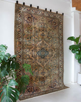 Vintage Turkish rug in living room setting, old rug, antique rug, pastel colors, faded colors, Turkish rug, vintage rug, soft rug, Portland, Oregon, rug store, rug shop, local shop