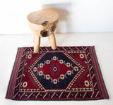 Vintage Turkish rug in a living room setting, pile rug, Turkish rug, vintage rug, portland, rug shop, bright colors, wild shaman, soft rug, bold color, Portland, Oregon, rug store, rug shop, local shop, antique rug