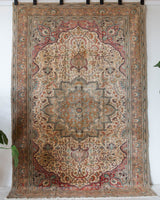 Vintage Turkish rug in living room setting, old rug, antique rug, pastel colors, faded colors, Turkish rug, vintage rug, soft rug, Portland, Oregon, rug store, rug shop, local shop