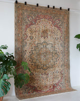 Vintage Turkish rug in living room setting, old rug, antique rug, pastel colors, faded colors, Turkish rug, vintage rug, soft rug, Portland, Oregon, rug store, rug shop, local shop
