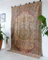 Vintage Turkish rug in living room setting, old rug, antique rug, pastel colors, faded colors, Turkish rug, vintage rug, soft rug, Portland, Oregon, rug store, rug shop, local shop