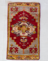 Vintage Turkish mini rug in room decor setting, old rug, antique rug, pastel colors, faded colors, Turkish rug, vintage rug, soft rug, Portland, Oregon, rug store, rug shop, local shop