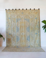 Vintage Turkish rug in living room setting, old rug, antique rug, pastel colors, faded colors, Turkish rug, vintage rug, soft rug, Portland, Oregon, rug store, rug shop, local shop
