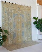 Vintage Turkish rug in living room setting, old rug, antique rug, pastel colors, faded colors, Turkish rug, vintage rug, soft rug, Portland, Oregon, rug store, rug shop, local shop