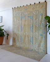 Vintage Turkish rug in living room setting, old rug, antique rug, pastel colors, faded colors, Turkish rug, vintage rug, soft rug, Portland, Oregon, rug store, rug shop, local shop