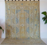 Vintage Turkish rug in living room setting, old rug, antique rug, pastel colors, faded colors, Turkish rug, vintage rug, soft rug, Portland, Oregon, rug store, rug shop, local shop