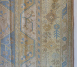 Vintage Turkish rug in living room setting, old rug, antique rug, pastel colors, faded colors, Turkish rug, vintage rug, soft rug, Portland, Oregon, rug store, rug shop, local shop