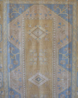 Vintage Turkish rug in living room setting, old rug, antique rug, pastel colors, faded colors, Turkish rug, vintage rug, soft rug, Portland, Oregon, rug store, rug shop, local shop