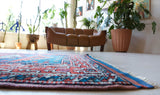 Vintage Turkish rug in a living room setting, pile rug, Turkish rug, vintage rug, portland, rug shop, bright colors, wild shaman, soft rug, bold color, Portland, Oregon, rug store, rug shop, local shop, antique rug