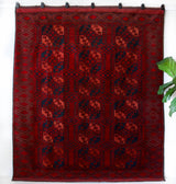 Antique Turkmen rug in a living room setting, pile rug, Turkish rug, vintage rug, portland, rug shop, bright colors, wild shaman, soft rug, bold color, Portland, Oregon, rug store, rug shop, local shop, antique rug