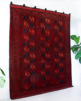 Antique Turkmen rug in a living room setting, pile rug, Turkish rug, vintage rug, portland, rug shop, bright colors, wild shaman, soft rug, bold color, Portland, Oregon, rug store, rug shop, local shop, antique rug