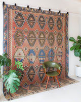 Vintage kilim rug in living room setting, old rug, antique rug, pastel colors, faded colors, Turkish rug, vintage rug, soft rug, Portland, Oregon, rug store, rug shop, local shop
