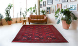 Antique Turkmen rug in a living room setting, pile rug, Turkish rug, vintage rug, portland, rug shop, bright colors, wild shaman, soft rug, bold color, Portland, Oregon, rug store, rug shop, local shop, antique rug