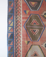 Vintage kilim rug in living room setting, old rug, antique rug, pastel colors, faded colors, Turkish rug, vintage rug, soft rug, Portland, Oregon, rug store, rug shop, local shop