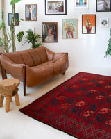 Antique Turkmen rug in a living room setting, pile rug, Turkish rug, vintage rug, portland, rug shop, bright colors, wild shaman, soft rug, bold color, Portland, Oregon, rug store, rug shop, local shop, antique rug