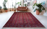 Antique Turkmen rug in a living room setting, pile rug, Turkish rug, vintage rug, portland, rug shop, bright colors, wild shaman, soft rug, bold color, Portland, Oregon, rug store, rug shop, local shop, antique rug