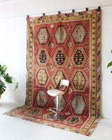 Vintage kilim rug in room decor setting, kilim, Turkish rug, vintage rug, portland, rug shop, bright colors, wild shaman, bold color, Portland, Oregon, rug store, rug shop, local shop, antique rug