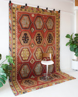 Vintage kilim rug in room decor setting, kilim, Turkish rug, vintage rug, portland, rug shop, bright colors, wild shaman, bold color, Portland, Oregon, rug store, rug shop, local shop, antique rug