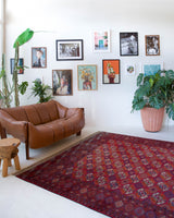 Antique Turkmen rug in a living room setting, pile rug, Turkish rug, vintage rug, portland, rug shop, bright colors, wild shaman, soft rug, bold color, Portland, Oregon, rug store, rug shop, local shop, antique rug