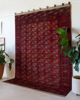 Antique Turkmen rug in a living room setting, pile rug, Turkish rug, vintage rug, portland, rug shop, bright colors, wild shaman, soft rug, bold color, Portland, Oregon, rug store, rug shop, local shop, antique rug