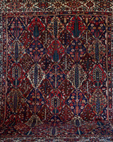 Antique Persian area rug in a living room setting, pile rug, vintage rug, portland, rug shop, bright colors, wild shaman, soft rug, bold color, Portland, Oregon, rug store, rug shop, local shop, antique rug, Persian rug, handmade rug, wool rug