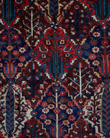 Antique Persian area rug in a living room setting, pile rug, vintage rug, portland, rug shop, bright colors, wild shaman, soft rug, bold color, Portland, Oregon, rug store, rug shop, local shop, antique rug, Persian rug, handmade rug, wool rug