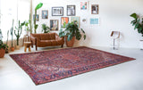 Antique Persian area rug in a living room setting, pile rug, vintage rug, portland, rug shop, bright colors, wild shaman, soft rug, bold color, Portland, Oregon, rug store, rug shop, local shop, antique rug, Persian rug, handmade rug, wool rug
