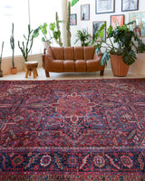 Antique Persian area rug in a living room setting, pile rug, vintage rug, portland, rug shop, bright colors, wild shaman, soft rug, bold color, Portland, Oregon, rug store, rug shop, local shop, antique rug, Persian rug, handmade rug, wool rug