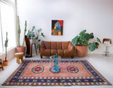 Vintage Turkish rug in a living room setting, pile rug, Turkish rug, vintage rug, portland, rug shop, bright colors, wild shaman, soft rug, bold color, Portland, Oregon, rug store, rug shop, local shop