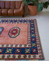 Vintage Turkish rug in a living room setting, pile rug, Turkish rug, vintage rug, portland, rug shop, bright colors, wild shaman, soft rug, bold color, Portland, Oregon, rug store, rug shop, local shop