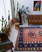 Vintage Turkish rug in a living room setting, pile rug, Turkish rug, vintage rug, portland, rug shop, bright colors, wild shaman, soft rug, bold color, Portland, Oregon, rug store, rug shop, local shop