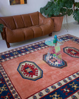 Vintage Turkish rug in a living room setting, pile rug, Turkish rug, vintage rug, portland, rug shop, bright colors, wild shaman, soft rug, bold color, Portland, Oregon, rug store, rug shop, local shop