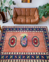 Vintage Turkish rug in a living room setting, pile rug, Turkish rug, vintage rug, portland, rug shop, bright colors, wild shaman, soft rug, bold color, Portland, Oregon, rug store, rug shop, local shop