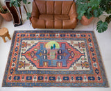 Vintage caucasian rug in a living room setting, pile rug, Turkish rug, vintage rug, portland, rug shop, bright colors, wild shaman, soft rug, bold color, Portland, Oregon, rug store, rug shop, local shop, soft rug, pastel colors, faded colors