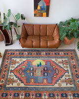 Vintage caucasian rug in a living room setting, pile rug, Turkish rug, vintage rug, portland, rug shop, bright colors, wild shaman, soft rug, bold color, Portland, Oregon, rug store, rug shop, local shop, soft rug, pastel colors, faded colors
