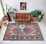 Vintage caucasian rug in a living room setting, pile rug, Turkish rug, vintage rug, portland, rug shop, bright colors, wild shaman, soft rug, bold color, Portland, Oregon, rug store, rug shop, local shop, soft rug, pastel colors, faded colors
