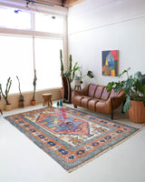 Vintage caucasian rug in a living room setting, pile rug, Turkish rug, vintage rug, portland, rug shop, bright colors, wild shaman, soft rug, bold color, Portland, Oregon, rug store, rug shop, local shop, soft rug, pastel colors, faded colors
