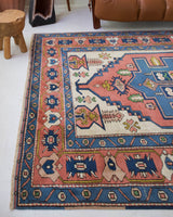 Vintage caucasian rug in a living room setting, pile rug, Turkish rug, vintage rug, portland, rug shop, bright colors, wild shaman, soft rug, bold color, Portland, Oregon, rug store, rug shop, local shop, soft rug, pastel colors, faded colors