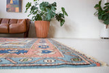 Vintage caucasian rug in a living room setting, pile rug, Turkish rug, vintage rug, portland, rug shop, bright colors, wild shaman, soft rug, bold color, Portland, Oregon, rug store, rug shop, local shop, soft rug, pastel colors, faded colors