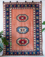 Vintage Turkish rug in a living room setting, pile rug, Turkish rug, vintage rug, portland, rug shop, bright colors, wild shaman, soft rug, bold color, Portland, Oregon, rug store, rug shop, local shop
