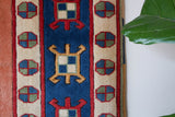 Vintage Turkish rug in a living room setting, pile rug, Turkish rug, vintage rug, portland, rug shop, bright colors, wild shaman, soft rug, bold color, Portland, Oregon, rug store, rug shop, local shop
