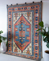 Vintage caucasian rug in a living room setting, pile rug, Turkish rug, vintage rug, portland, rug shop, bright colors, wild shaman, soft rug, bold color, Portland, Oregon, rug store, rug shop, local shop, soft rug, pastel colors, faded colors