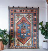 Vintage caucasian rug in a living room setting, pile rug, Turkish rug, vintage rug, portland, rug shop, bright colors, wild shaman, soft rug, bold color, Portland, Oregon, rug store, rug shop, local shop, soft rug, pastel colors, faded colors