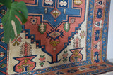 Vintage caucasian rug in a living room setting, pile rug, Turkish rug, vintage rug, portland, rug shop, bright colors, wild shaman, soft rug, bold color, Portland, Oregon, rug store, rug shop, local shop, soft rug, pastel colors, faded colors