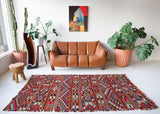 Vintage kilim rug in living room setting, bright colors, wild shaman, soft rug, bold color, Portland, Oregon, rug store, rug shop, local shop, vintage rug, modern kilim