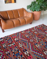 Vintage kilim rug in living room setting, bright colors, wild shaman, soft rug, bold color, Portland, Oregon, rug store, rug shop, local shop, vintage rug, modern kilim